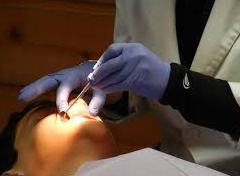 dentist fixing Braces