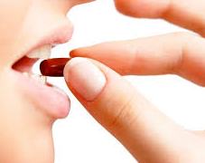 woman taking supplement
