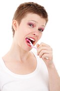 woman brushing teeth