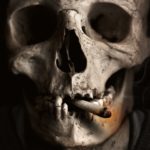 a skull smoking ciggie